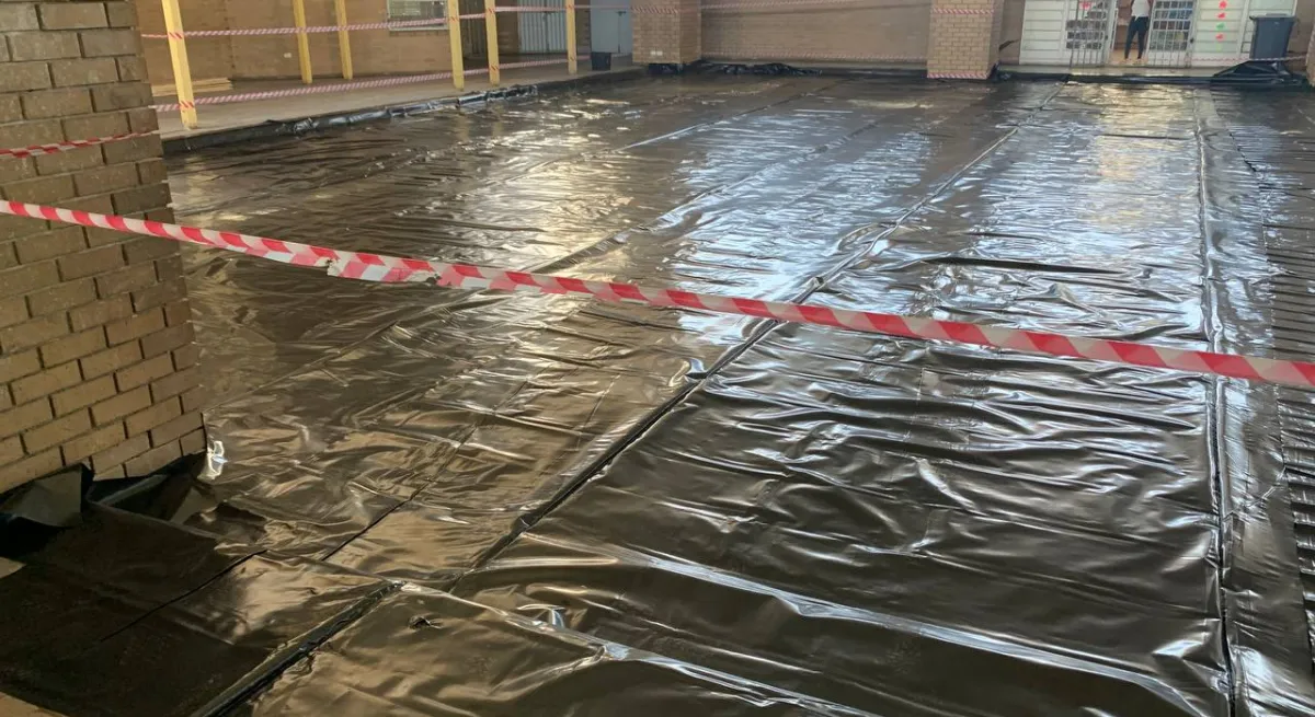 BEFORE - Mzamomtsha Primary School Hall floor during rainy season 2